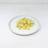 Pastinakenwürfel blanchiert und gefroren.